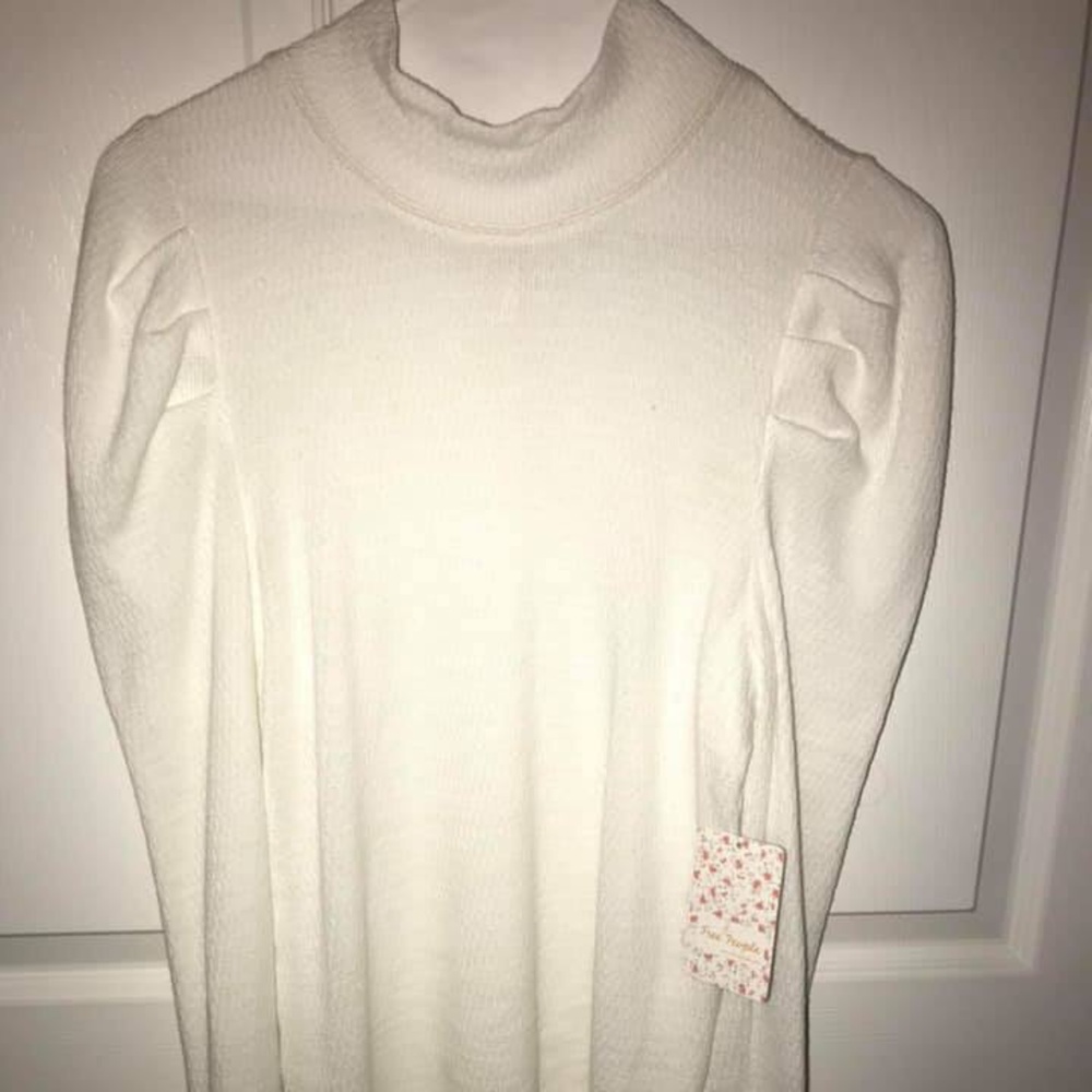 Free people long sleeve with ruffles. Never worn.
